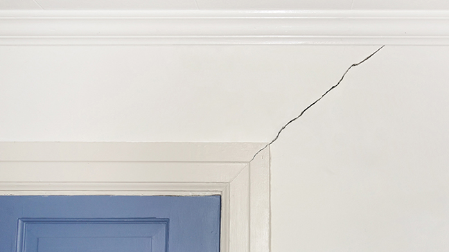 Image A sign of home foundation issues is having a crack on top of door and windows